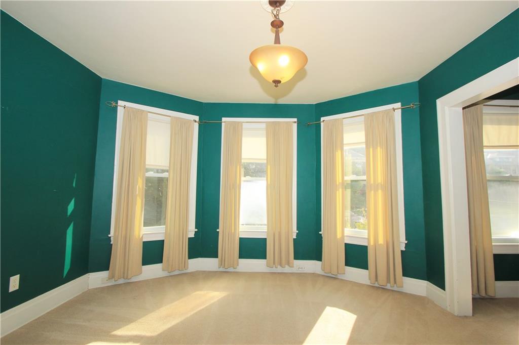 915 Malvern Road Pittsburgh, PA 15202 - Photo 13 of 23 The spacious master bedroom on the second floor has neutral carpet and multiple windows shower the room in natural light.