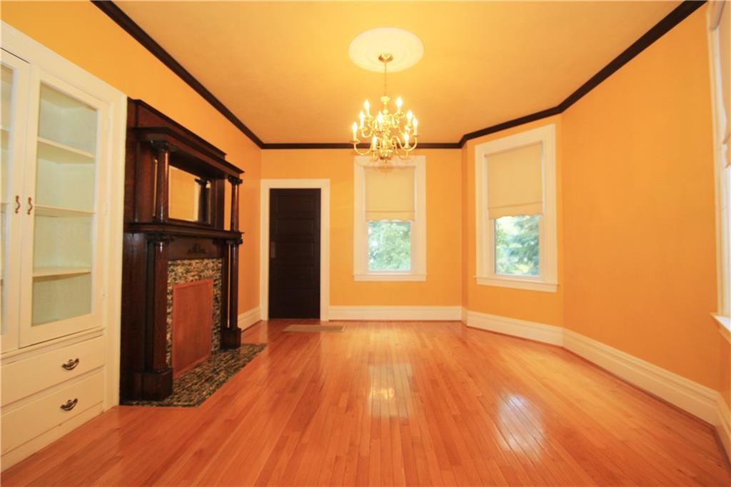 915 Malvern Road Pittsburgh, PA 15202 - Photo 3 of 23 The dining room has beautiful Oak hardwood floors, crown molding and large windows that shower the room in natural light. The doorway at the left rear of this picture leads to the butlers pantry - very convenient!