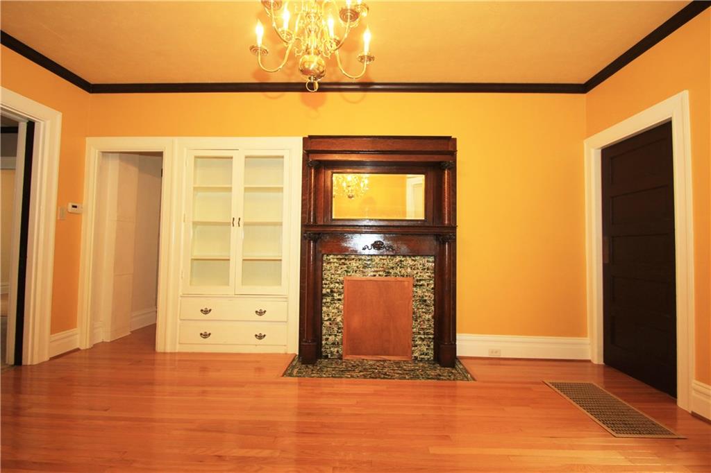 915 Malvern Road Pittsburgh, PA 15202 - Photo 7 of 23 This dining room picture provides a closer look at the custom built in china closet and the decorative fireplace with a beautiful wood mantel. This room is loaded with character.