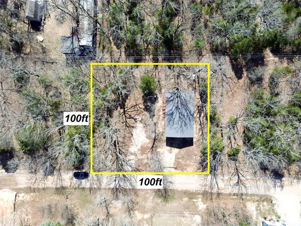 a view of outdoor space with a garden and signage