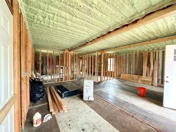 a view of a chair and table in the room