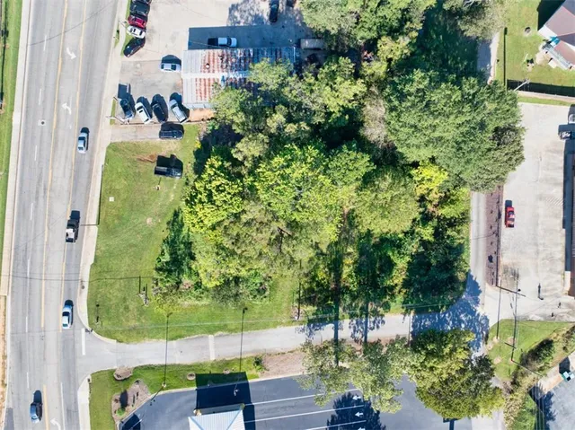 an aerial view of a houses with yard