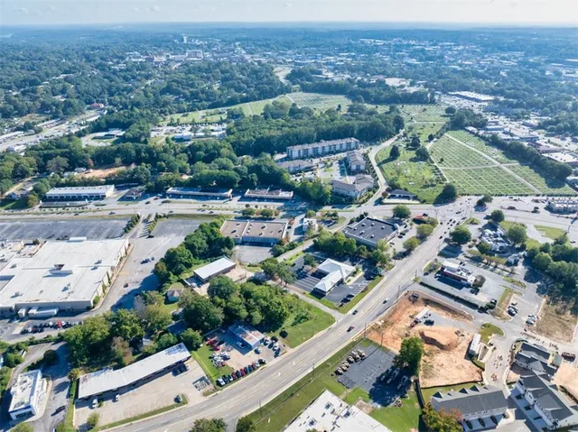 an aerial view of residential houses with outdoor space
