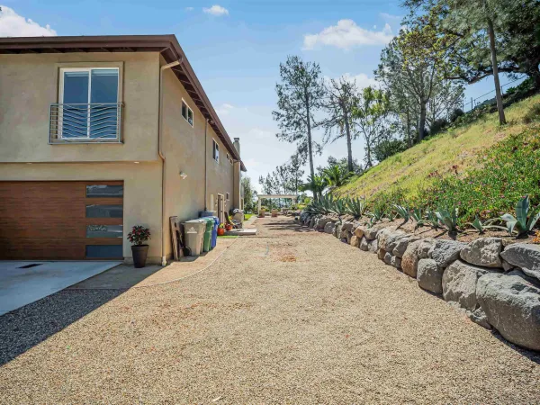 a view of a two chairs and table in the balcony