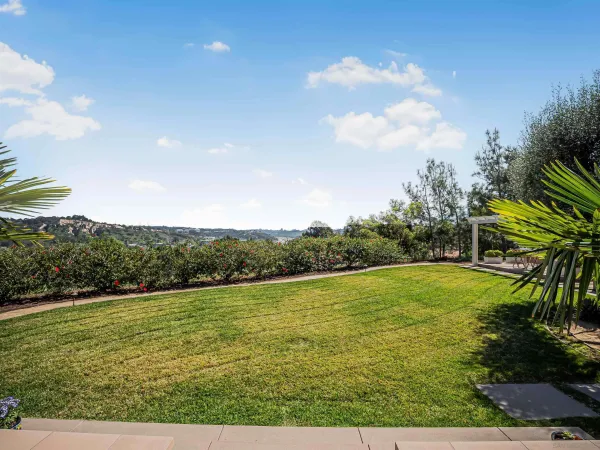 a kitchen with stainless steel appliances granite countertop a refrigerator a stove and a sink