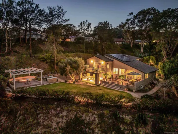 a view of a swimming pool with a yard