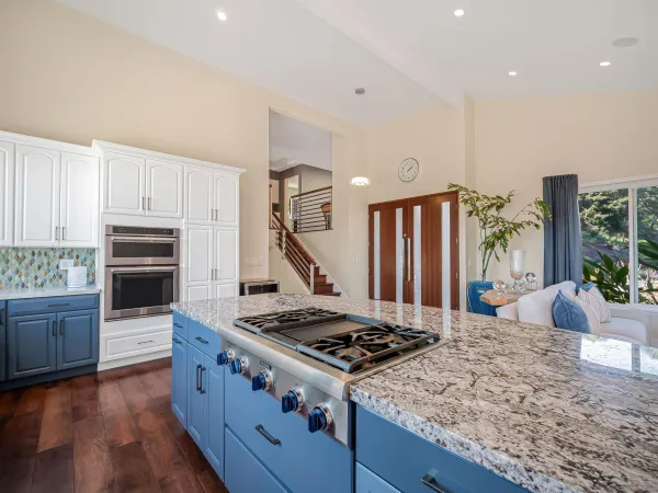 a living room with patio furniture and garden