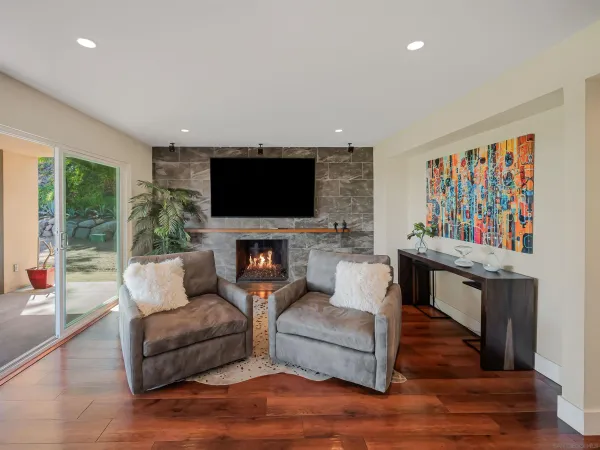 a bedroom with a large bed and a flat screen tv