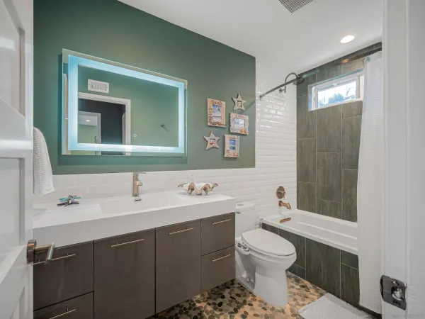 a roof deck with table and chairs and wooden floor