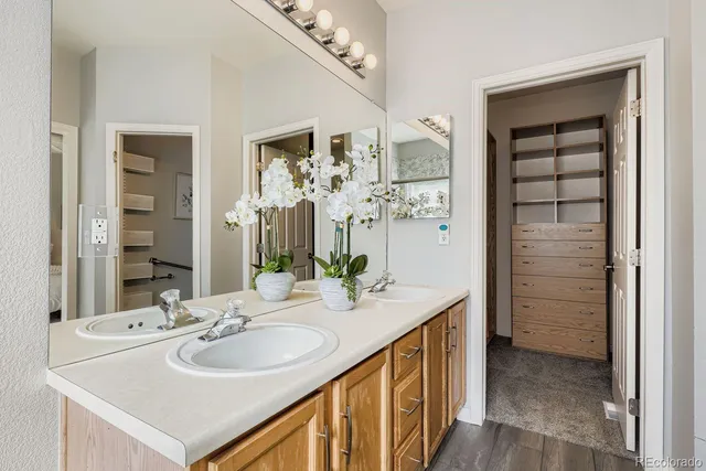 a bathroom with a sink double vanity and a mirror