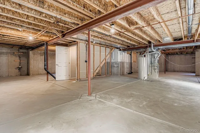 a view of a house with backyard and deck