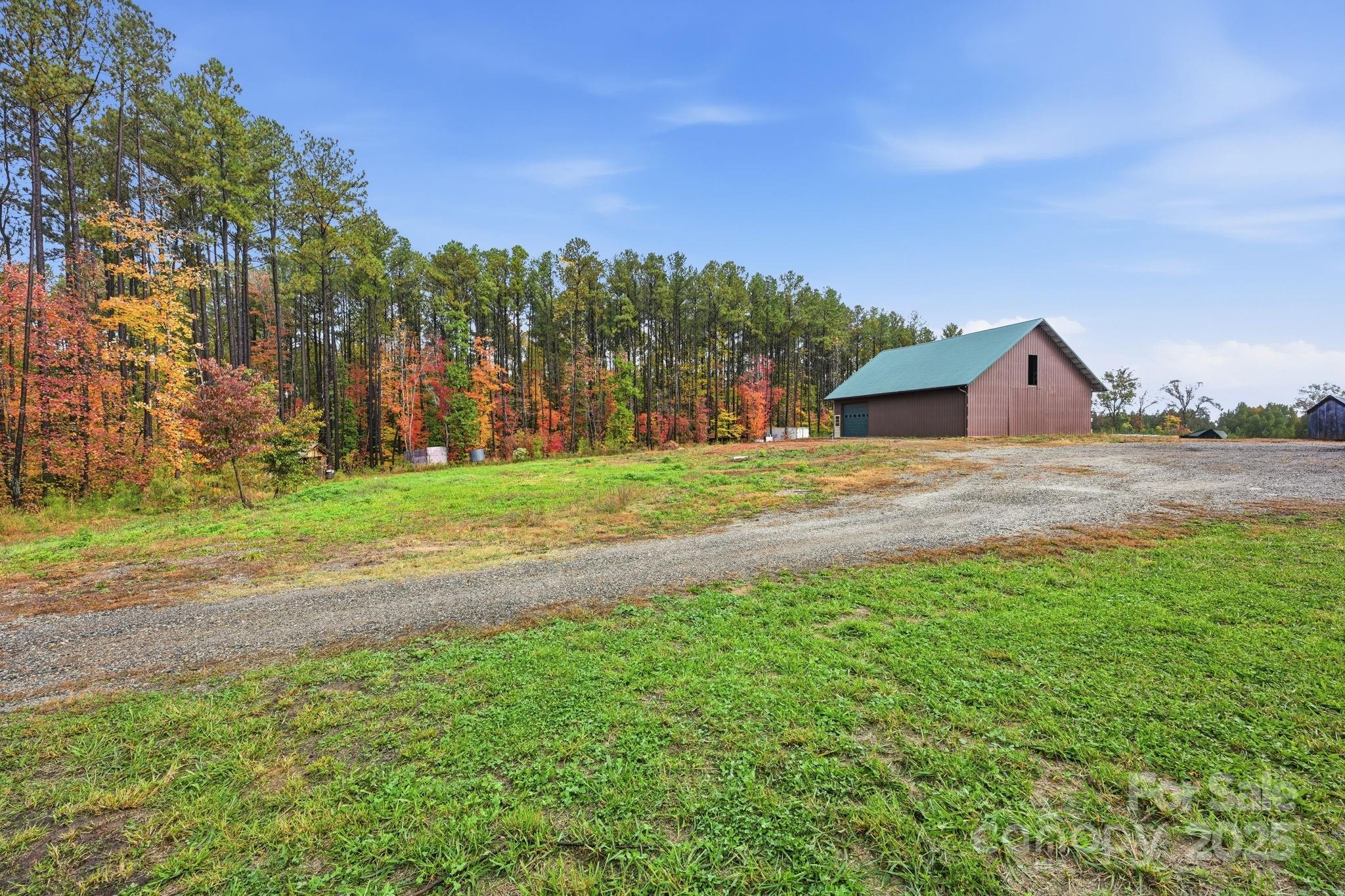 365 Kepley Road Salisbury, NC 28147 - Photo 26 of 48 a backyard of a house with lots of green space and mountain view in back