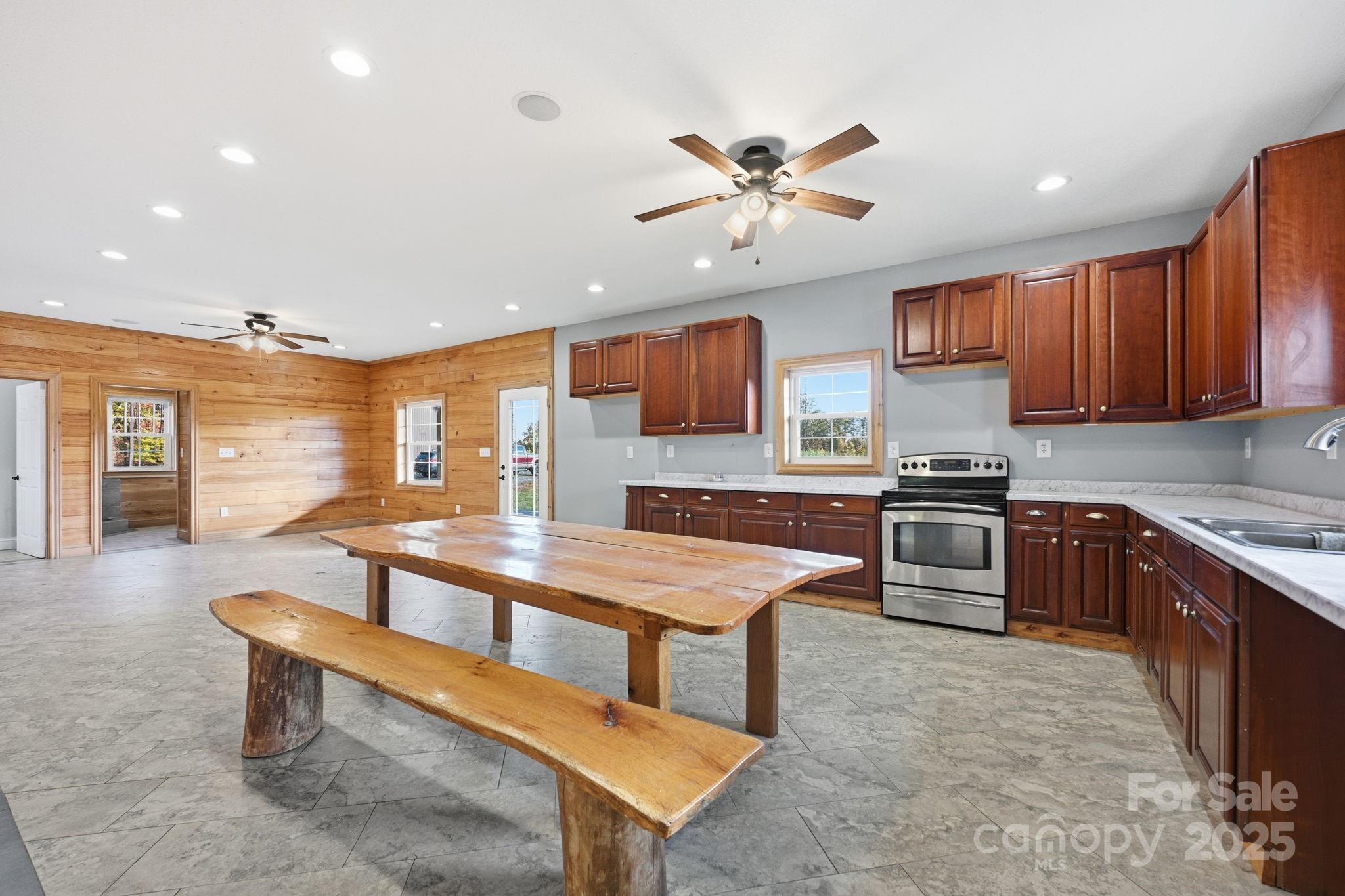 365 Kepley Road Salisbury, NC 28147 - Photo 27 of 48 a kitchen with stainless steel appliances kitchen island granite countertop a sink and a stove