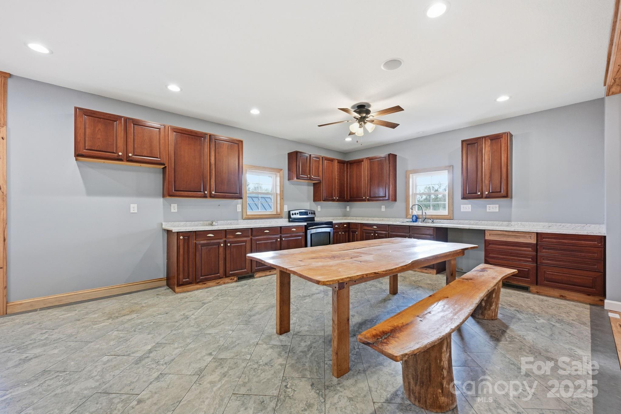 365 Kepley Road Salisbury, NC 28147 - Photo 28 of 48 a kitchen with a stove a refrigerator and a sink