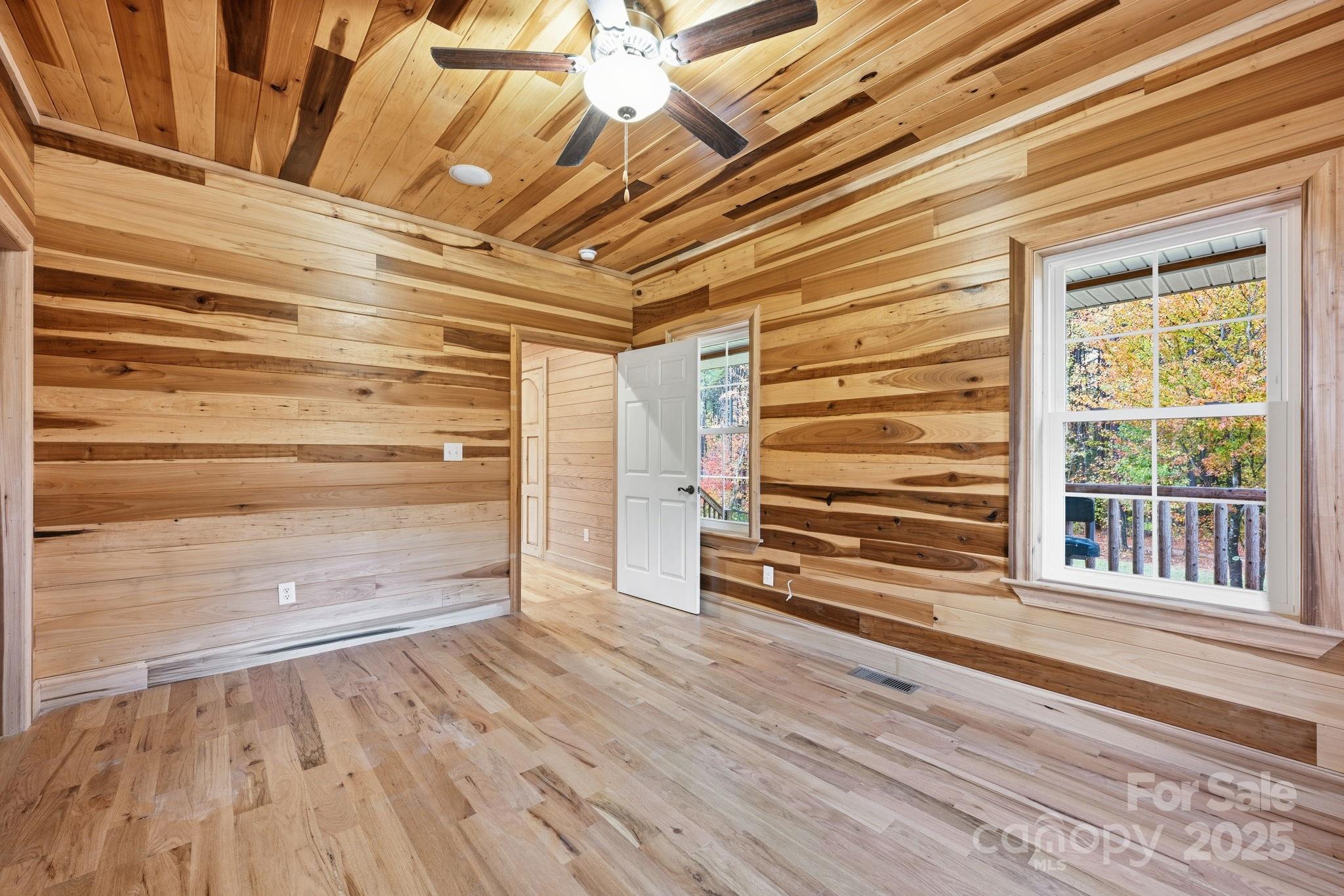 365 Kepley Road Salisbury, NC 28147 - Photo 9 of 48 a view of empty room with wooden floor and windows