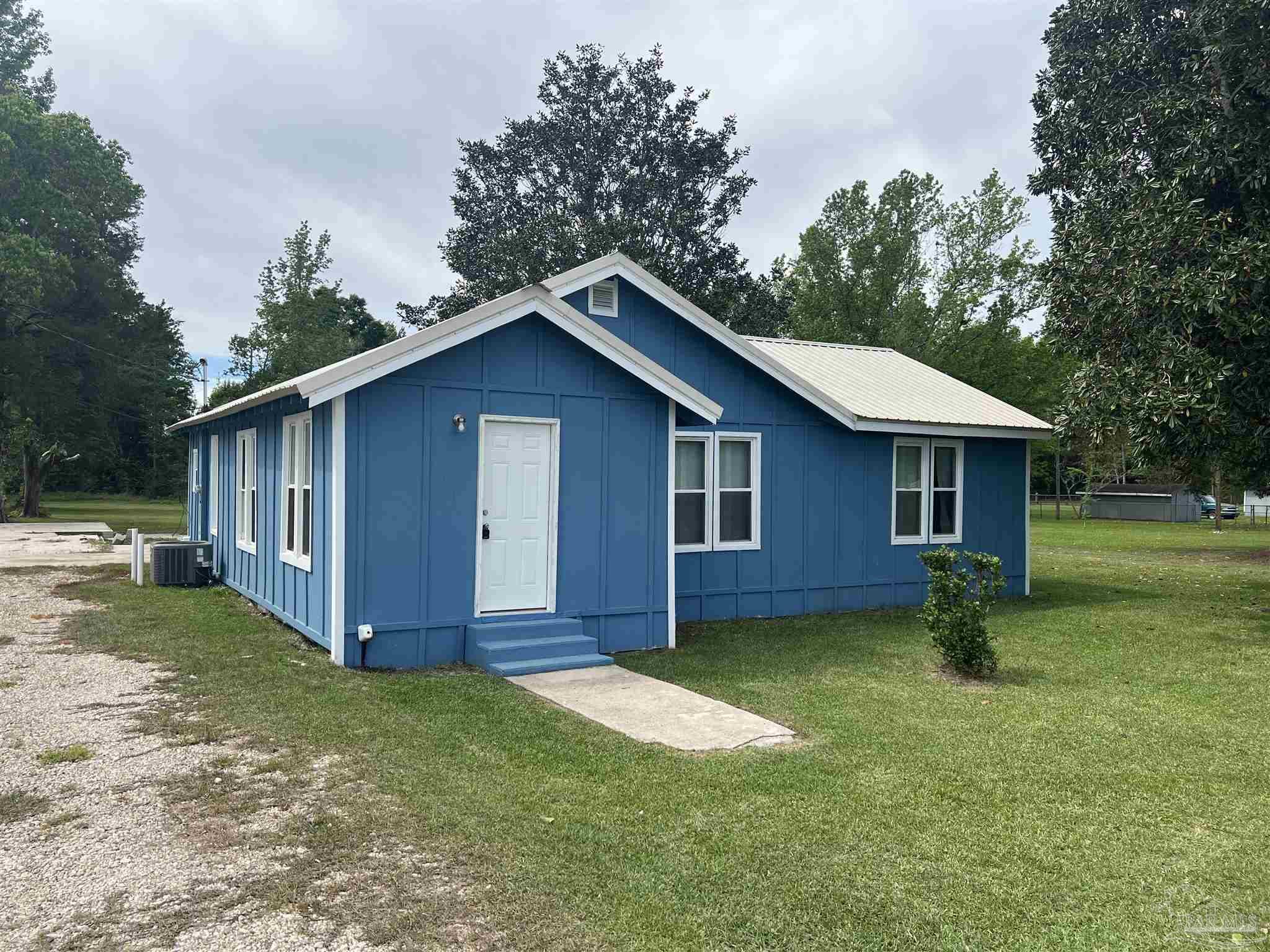 102 W Avenue Atmore, AL 36502 - Photo 20 of 25 a view of a house with backyard