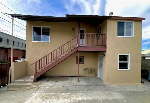a view of a house with wooden stairs