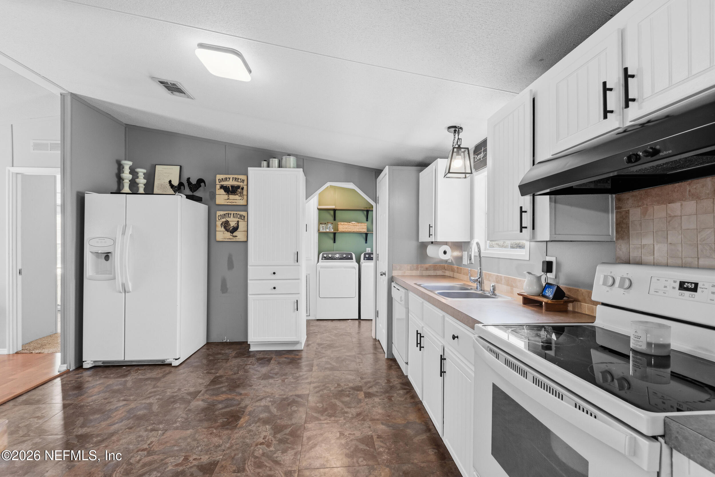 55097 Sugar Loaf Lane Callahan, FL 32011 - Photo 12 of 25 Kitchen into inside Laundry Room