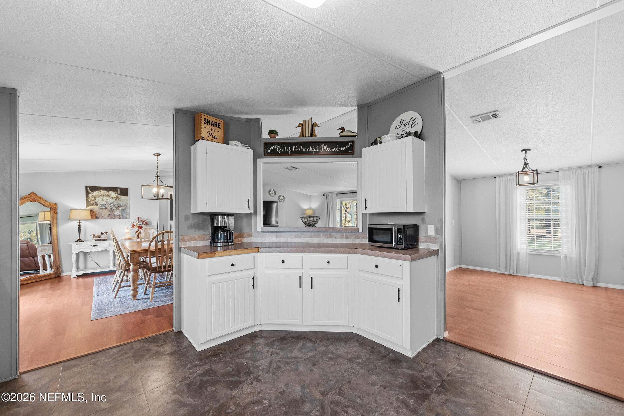 55097 Sugar Loaf Lane Callahan, FL 32011 - Photo 13 of 25 Kitchen into Dining Room and Great Room