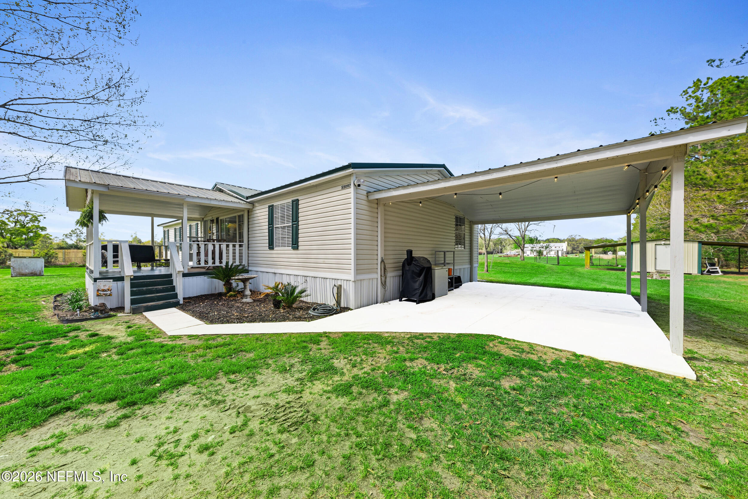 55097 Sugar Loaf Lane Callahan, FL 32011 - Photo 4 of 25 Carport area and entrance to Home