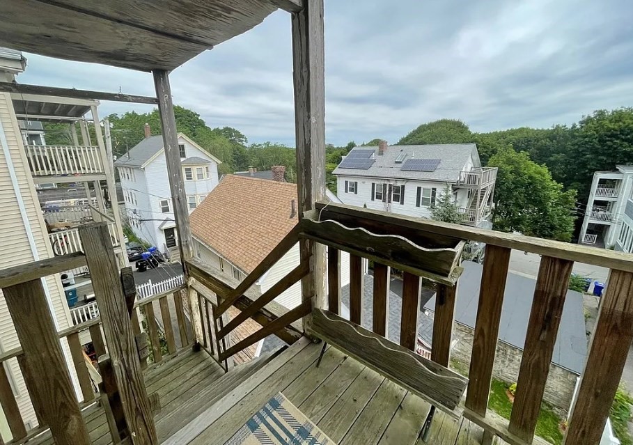 787 Boylston Street, Unit 3 Brookline, MA 02467 - Photo 11 of 11 a view of a balcony with chairs and wooden floor