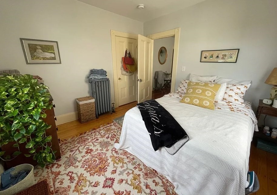 787 Boylston Street, Unit 3 Brookline, MA 02467 - Photo 4 of 11 a bedroom with a bed and a potted plant