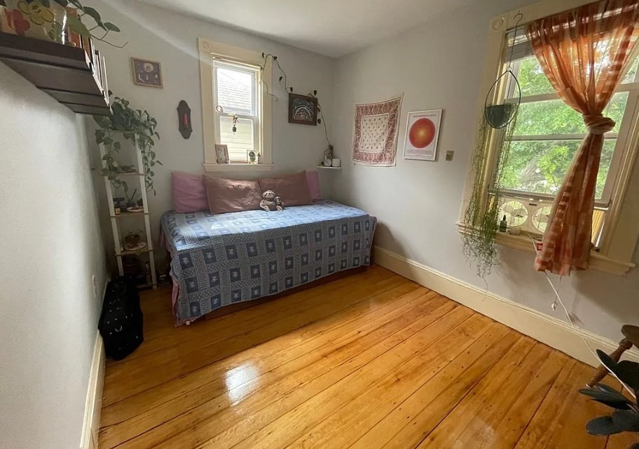 787 Boylston Street, Unit 3 Brookline, MA 02467 - Photo 7 of 11 a spacious bedroom with a bed and a dresser next to a window