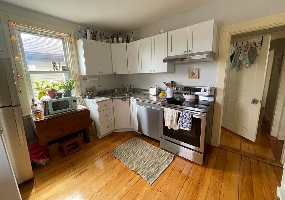 787 Boylston Street, Unit 3 Brookline, MA 02467 - Photo 8 of 11 a kitchen with stainless steel appliances granite countertop a stove a sink and a refrigerator