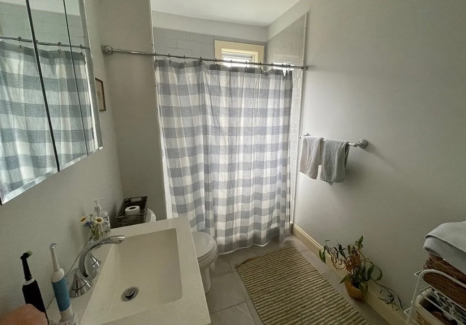 787 Boylston Street, Unit 3 Brookline, MA 02467 - Photo 9 of 11 a bathroom with a sink and a shower