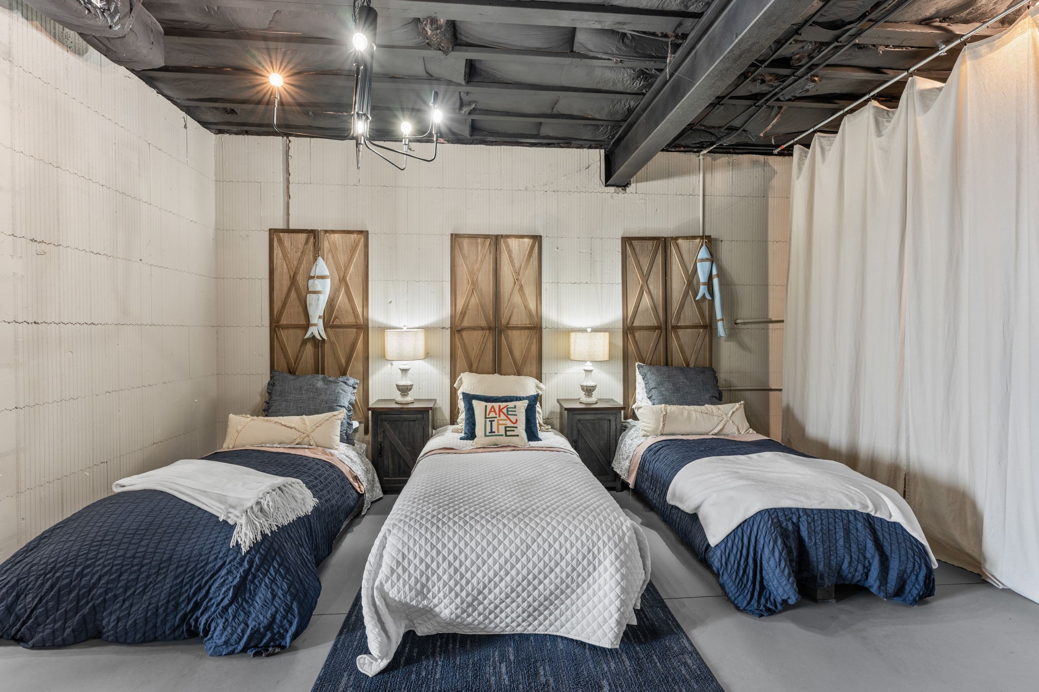 236 Beech Hill Drive Winchester, TN 37398 - Photo 68 of 70 a bedroom with two beds and a chandelier