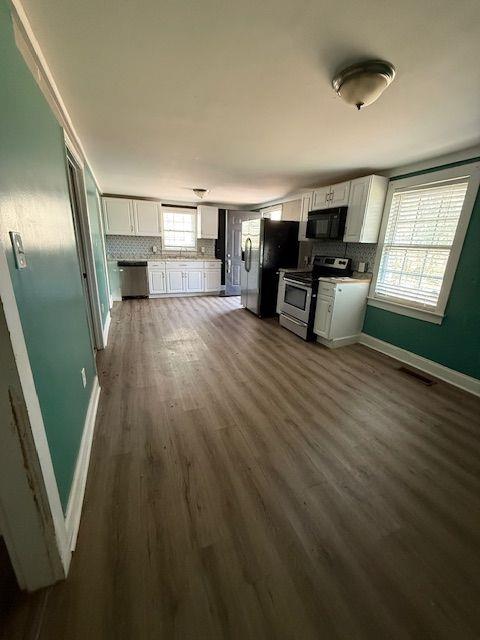 5715 Harding Drive Mableton, GA 30126 - Photo 11 of 13 a view of a livingroom with furniture wooden floor and windows