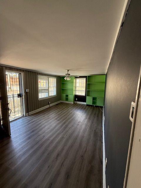 5715 Harding Drive Mableton, GA 30126 - Photo 5 of 13 an empty room with wooden floor and windows