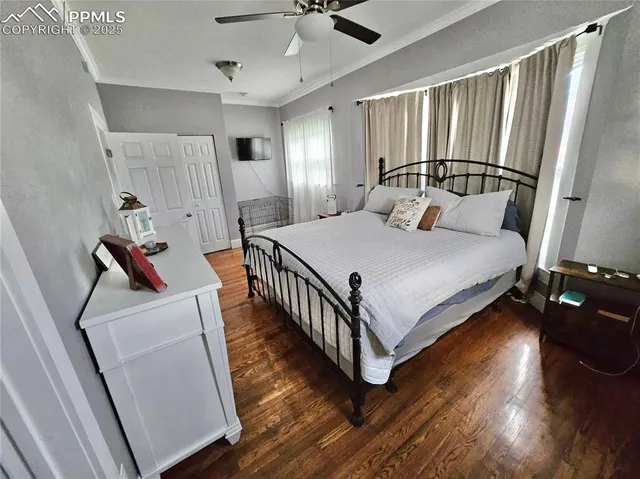 a bed room with furniture and wooden floor