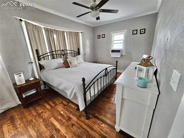 a bedroom with bed and a window