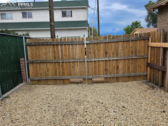 a view of a backyard of a house