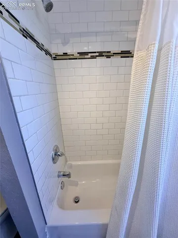 a bathroom with a sink and a shower