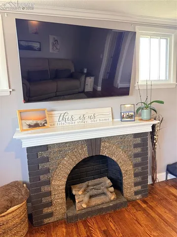 a kitchen with a sink and a fireplace