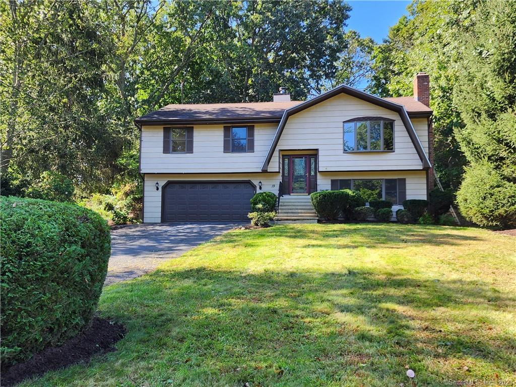 19 Round Hill Road Trumbull, CT 06611 - Photo 1 of 1 a front view of a house with swimming pool