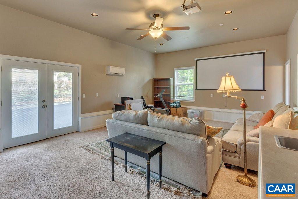 14 Powhatan Road Palmyra, VA 22963 - Photo 17 of 38 a living room with furniture and a chandelier