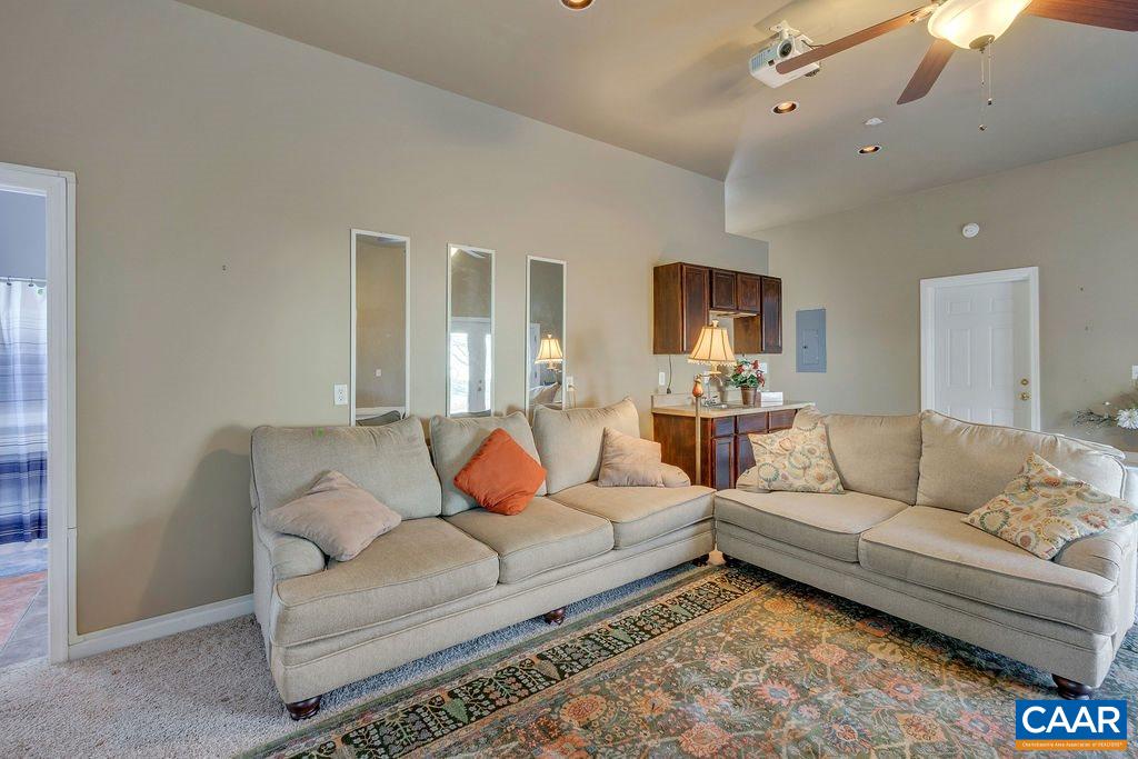 14 Powhatan Road Palmyra, VA 22963 - Photo 19 of 38 a living room with furniture and a flat screen tv