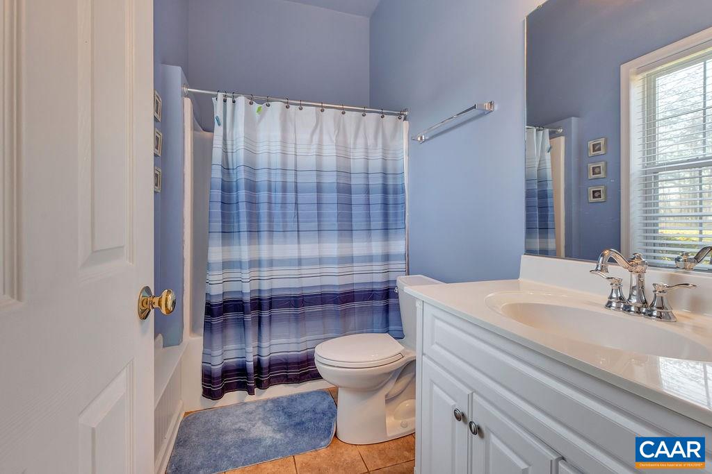 14 Powhatan Road Palmyra, VA 22963 - Photo 21 of 38 a bathroom with a sink toilet and shower