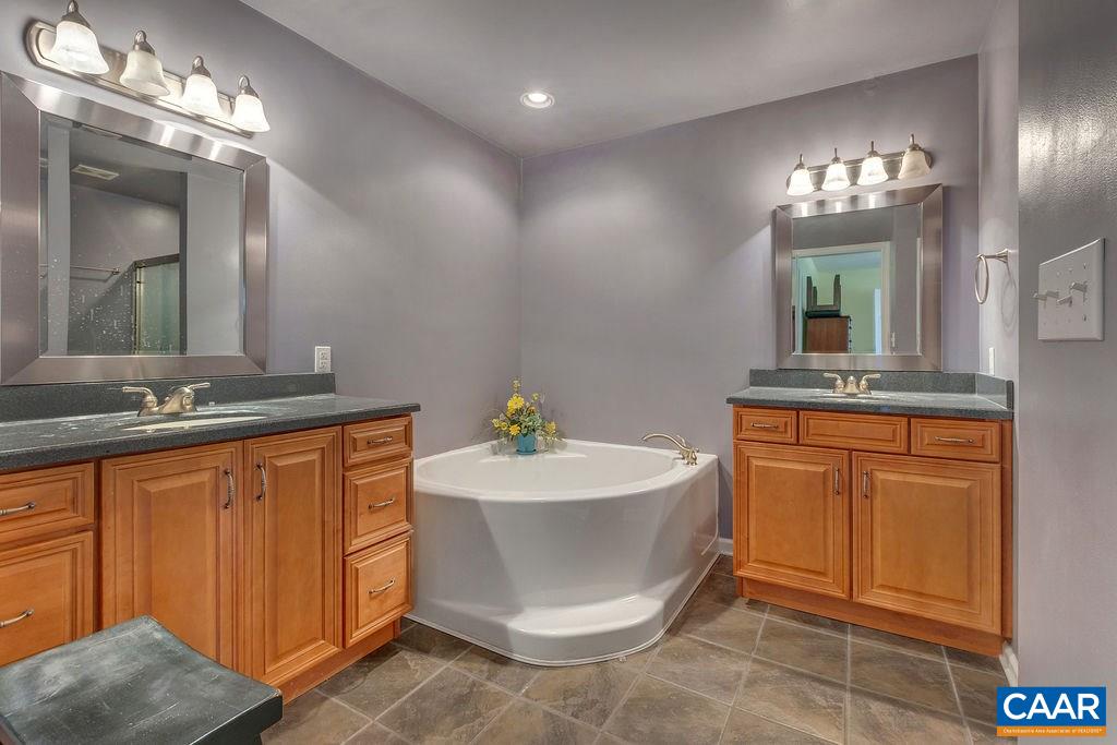 14 Powhatan Road Palmyra, VA 22963 - Photo 23 of 38 a bathroom with a sink and a mirror