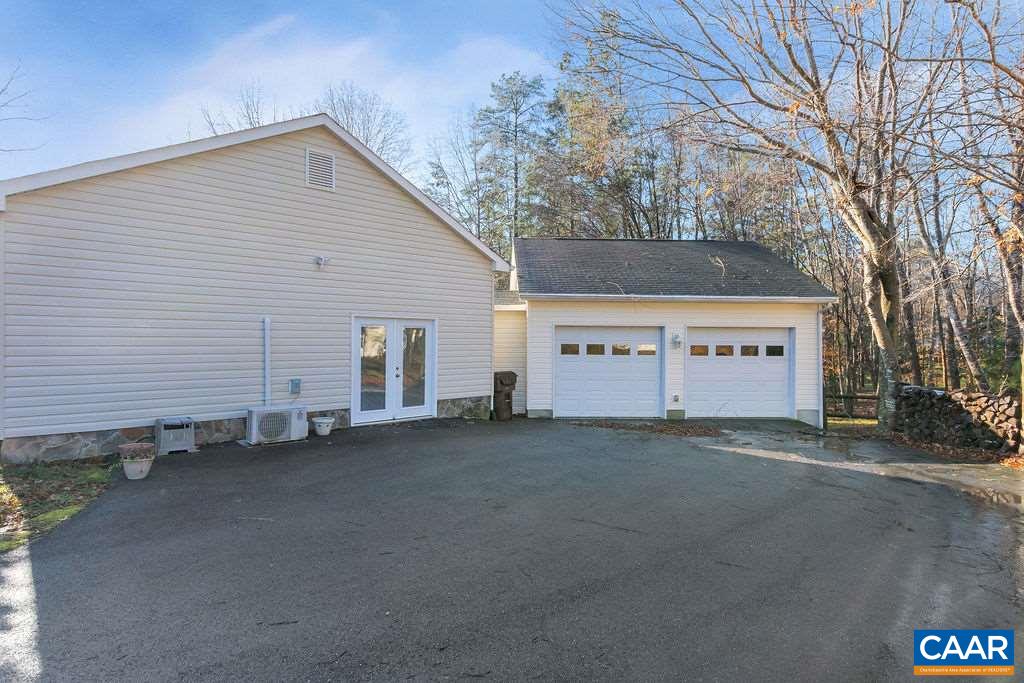 14 Powhatan Road Palmyra, VA 22963 - Photo 3 of 38 a view of a house with a yard and garage