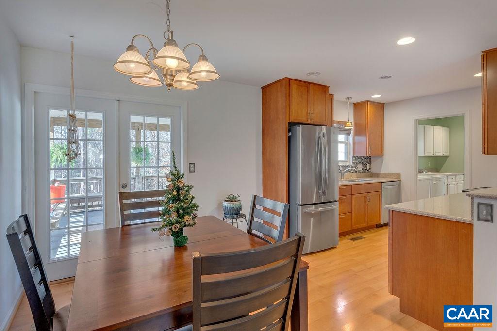 14 Powhatan Road Palmyra, VA 22963 - Photo 9 of 38 a kitchen with stainless steel appliances granite countertop a refrigerator dining table and chairs