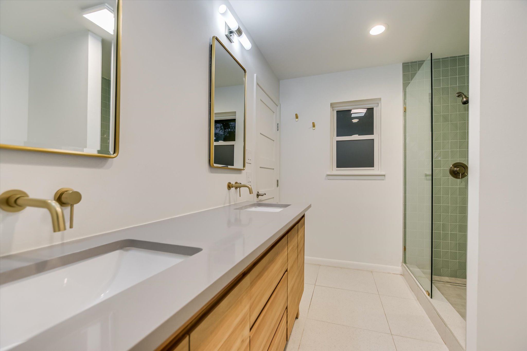 3921 Greystone Drive Austin, TX 78731 - Photo 16 of 30 a bathroom with a sink and a mirror