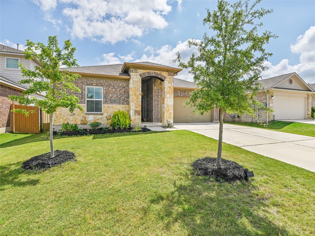 a house view with swimming pool in front of it