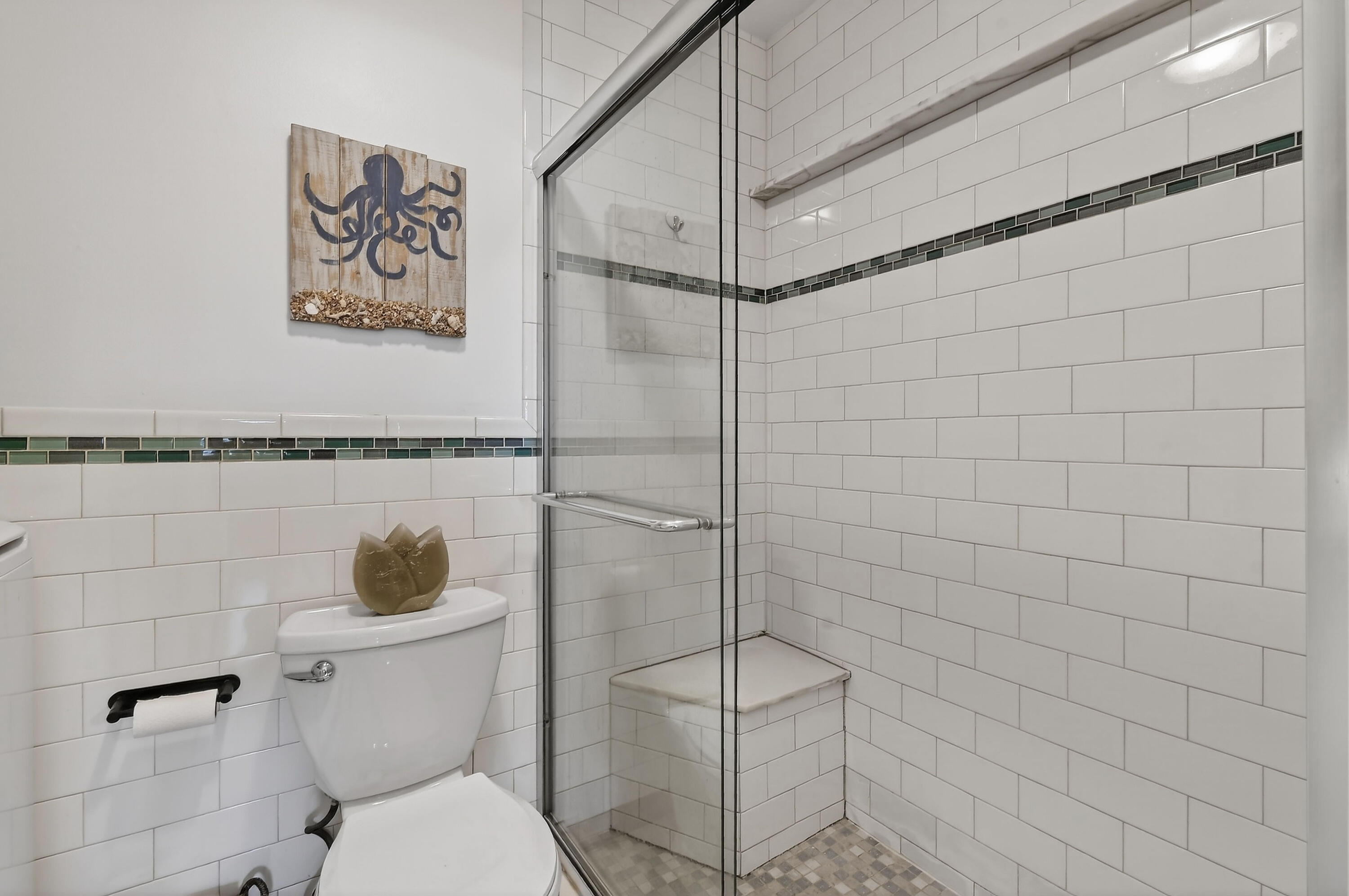 717 Highway 1, Unit 912 Jupiter, FL 33477 - Photo 25 of 45 a bathroom with a toilet and a shower