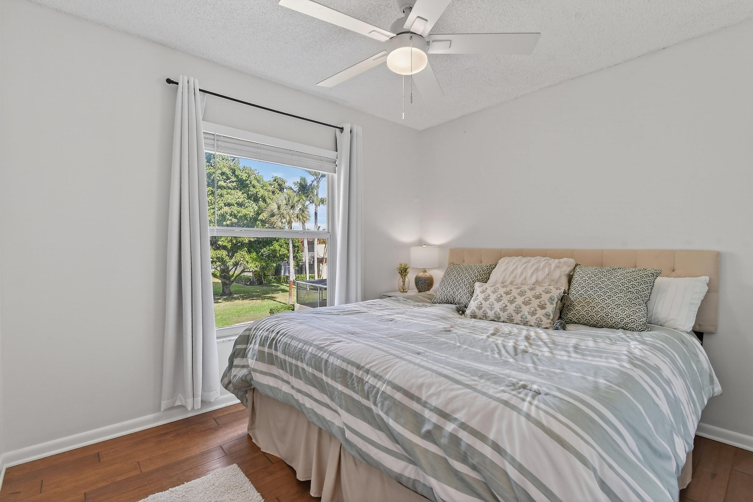 717 Highway 1, Unit 912 Jupiter, FL 33477 - Photo 27 of 45 a bedroom with a large bed and a window