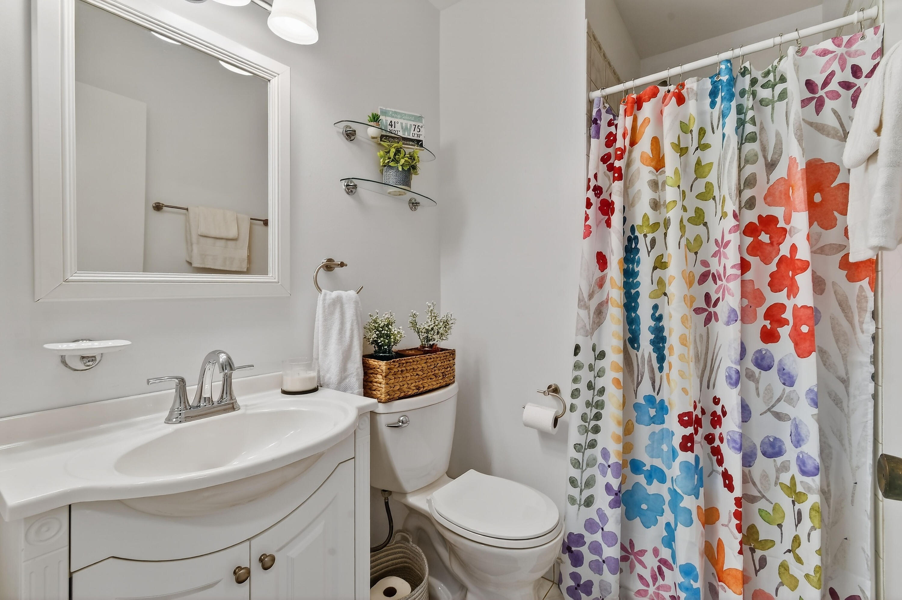717 Highway 1, Unit 912 Jupiter, FL 33477 - Photo 28 of 45 a white toilet sitting next to a bathroom sink