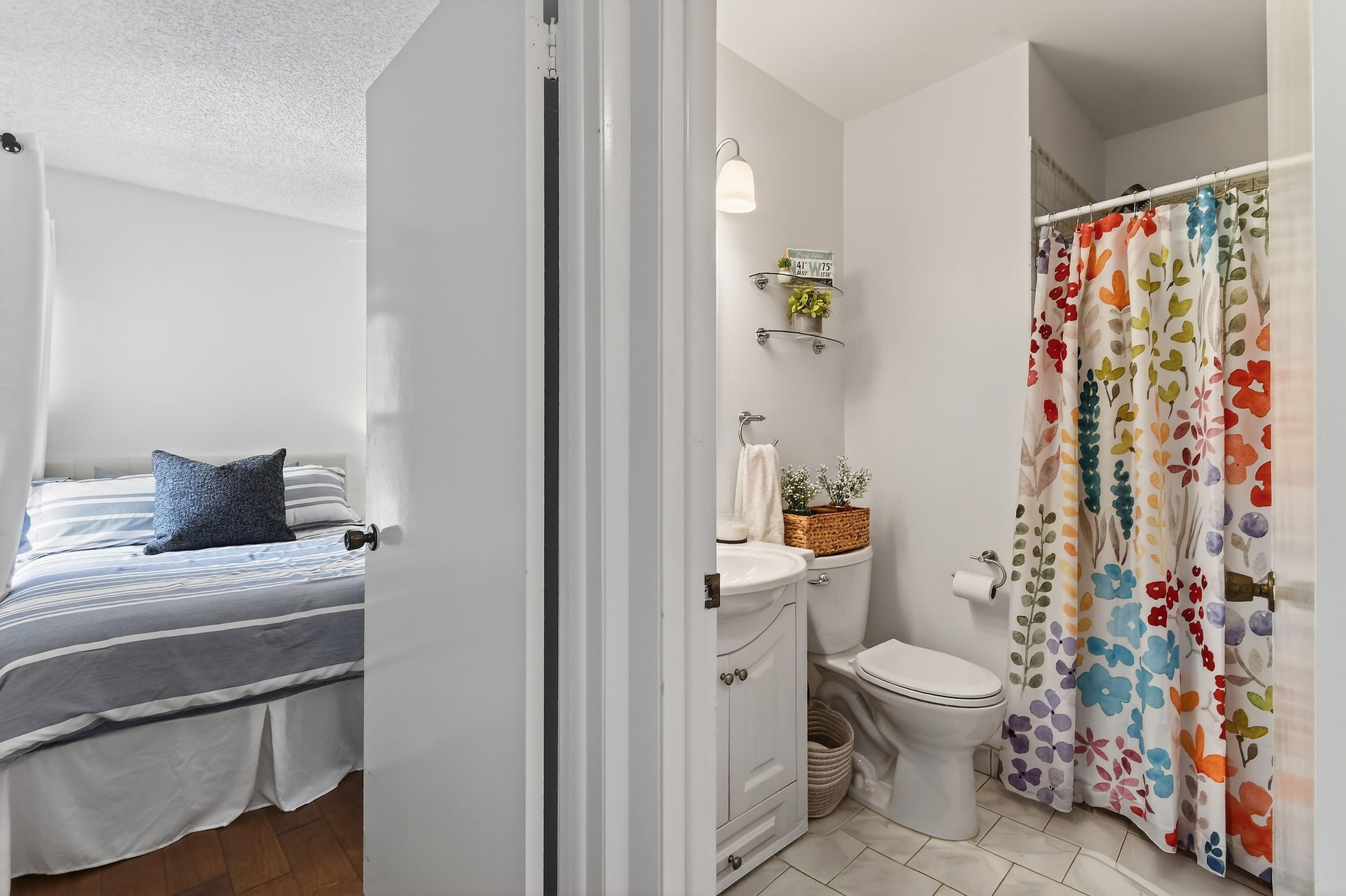 717 Highway 1, Unit 912 Jupiter, FL 33477 - Photo 29 of 45 a bathroom with a toilet and a shower curtain